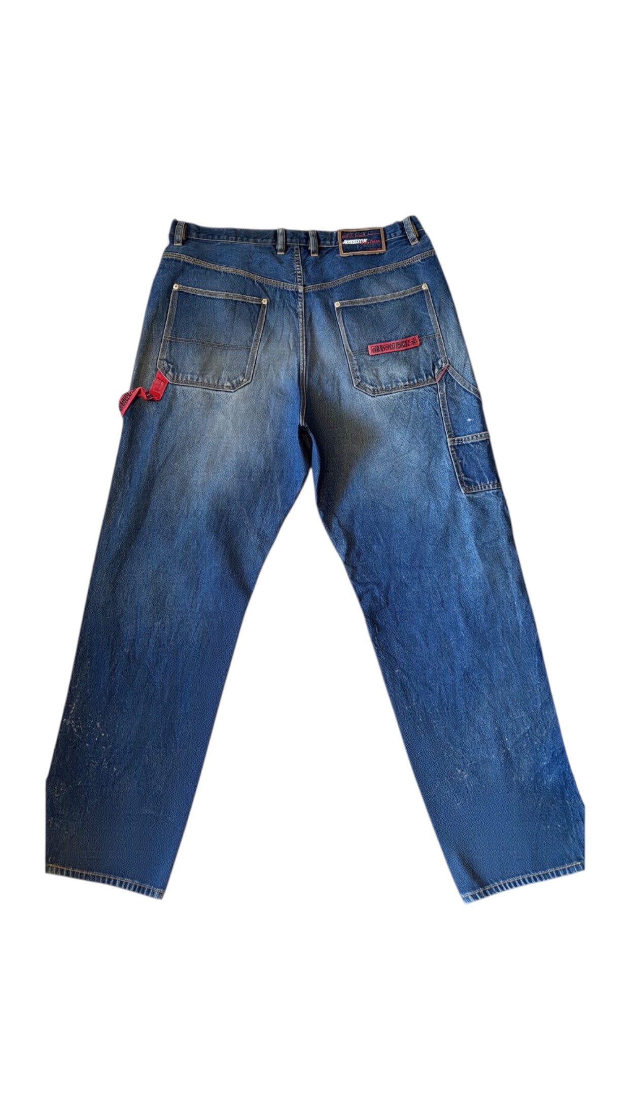 SohoStich Co. blue denim baggy carpenter jeans with distressed detailing and paint splatters.