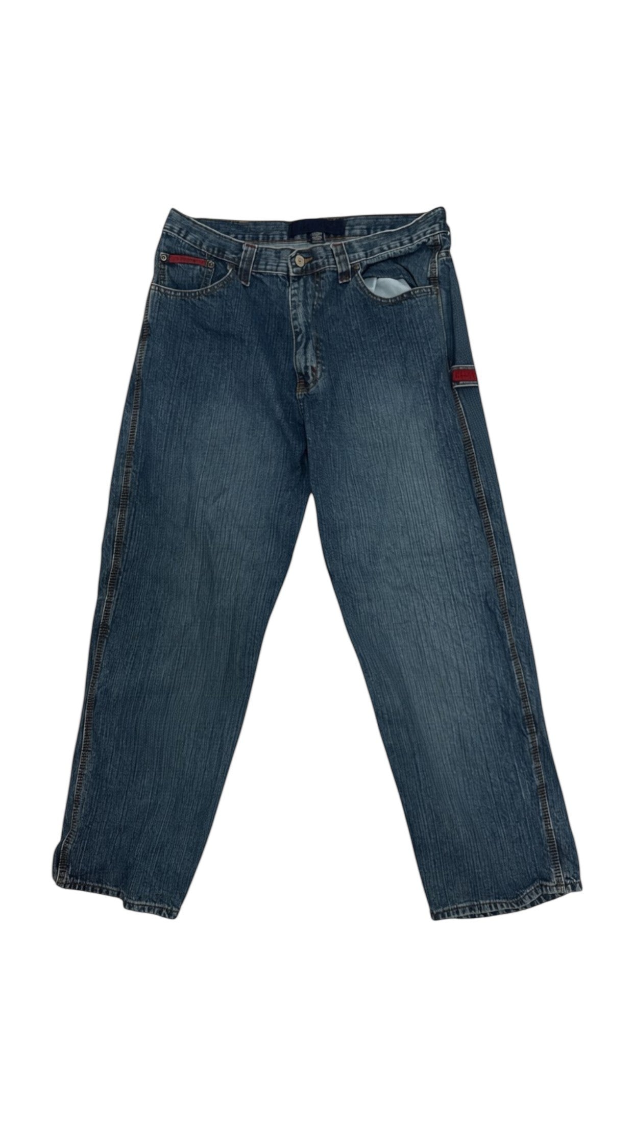 SohoStich Co. mid-wash denim jeans with a baggy fit and red accent patch on the right leg.
