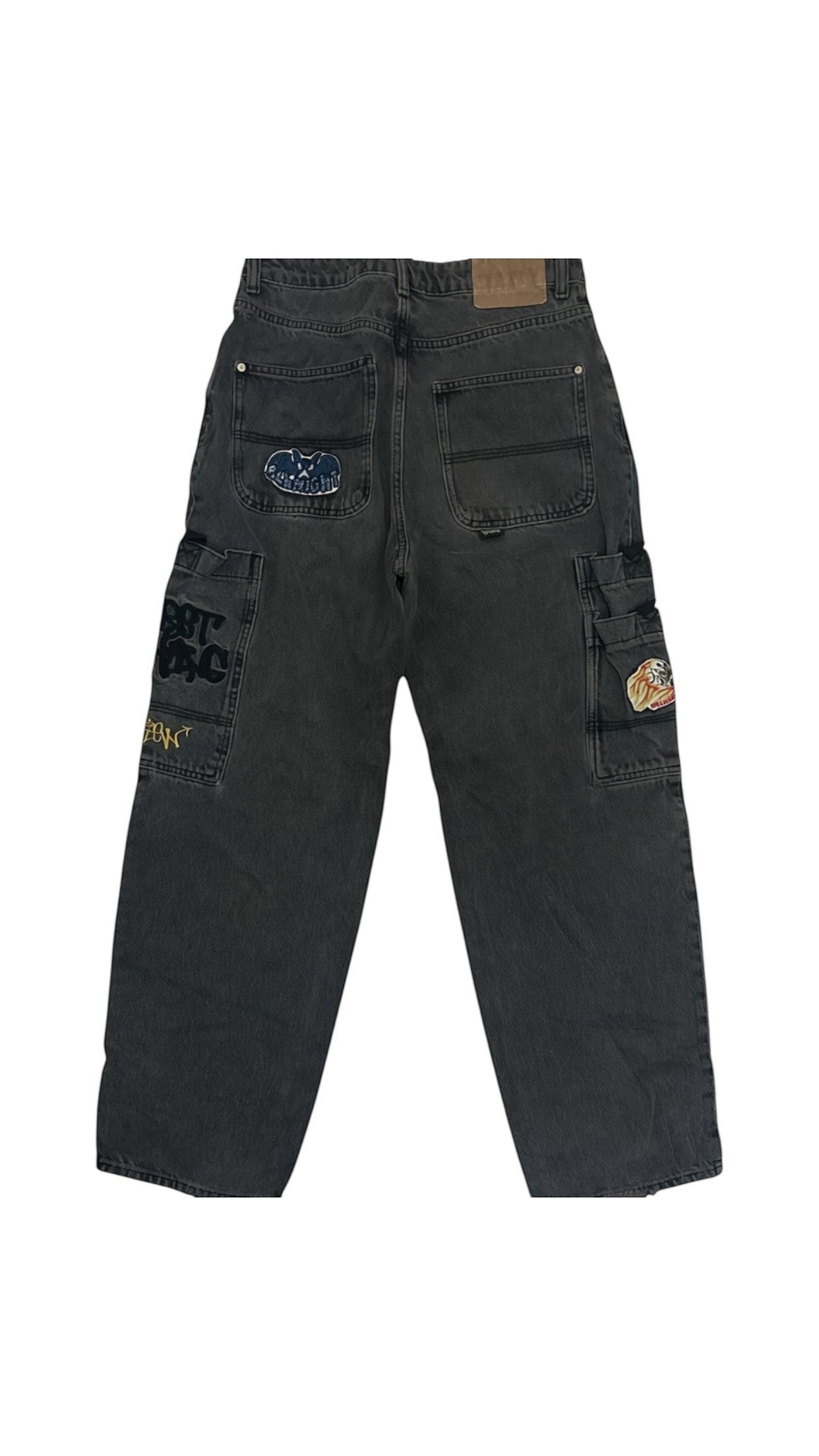 SohoStich Co. washed black denim baggy fit carpenter jeans with embroidered patches and graphic detailing.