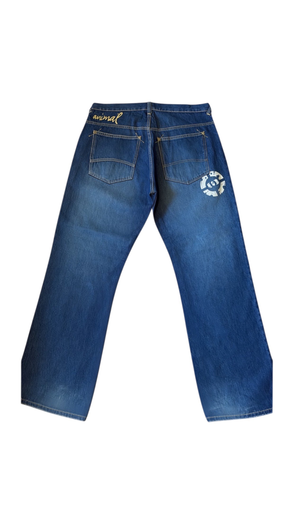 SohoStich Co. blue denim relaxed fit jeans with embroidered logo on back pocket and graphic detail.