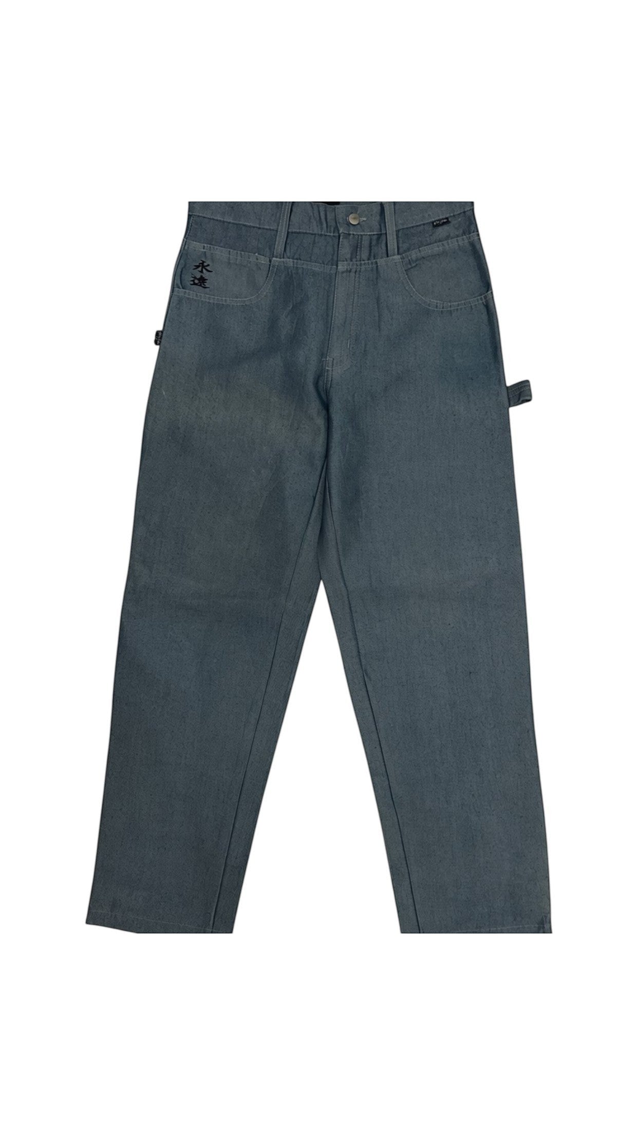 SohoStich Co. Classic mid-wash denim carpenter pants with five-pocket style, hammer loop, and subtle embroidered detailing.