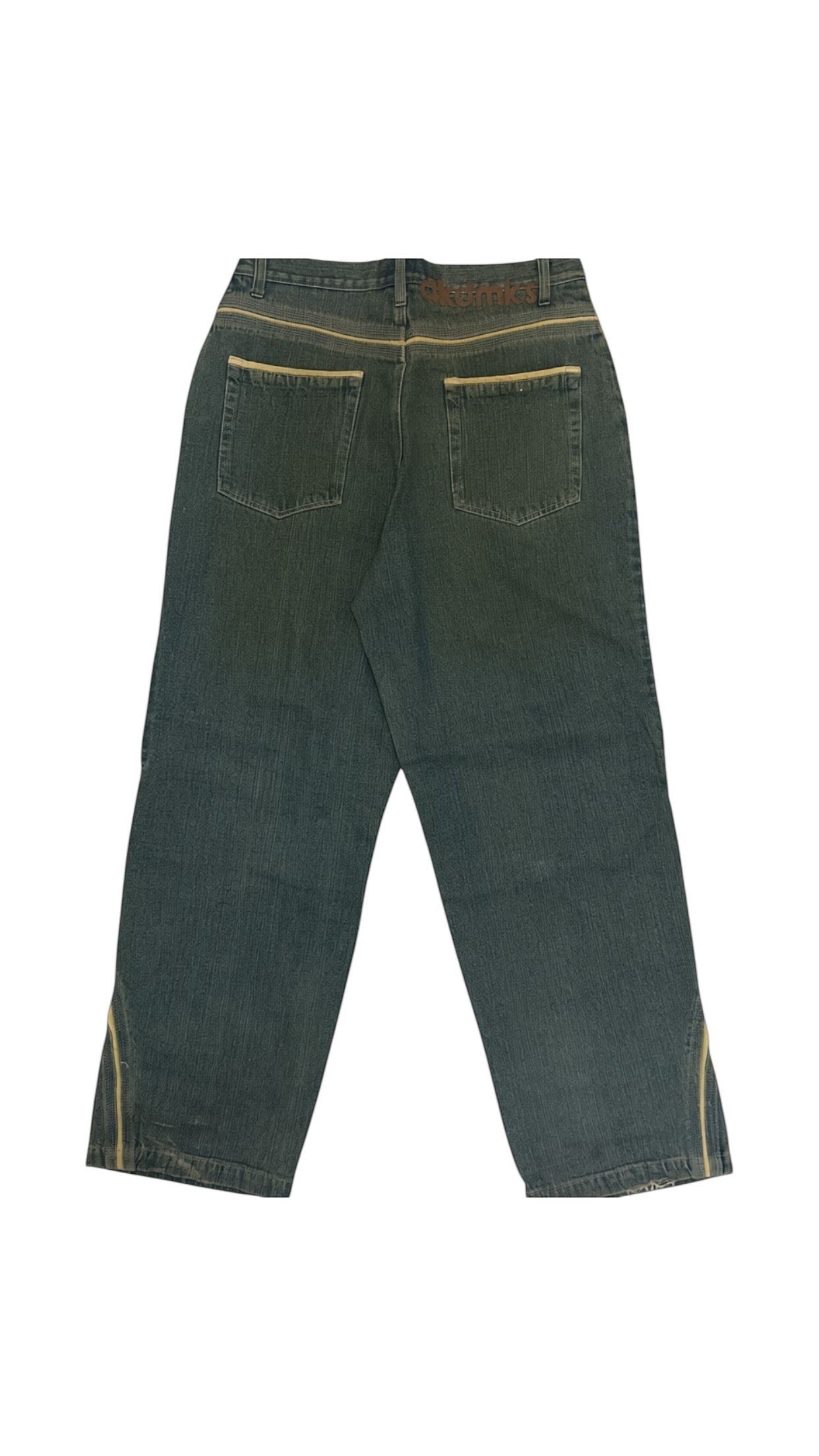 SohoStich Co. dark wash denim jeans with tan contrast stitching and vertical stripe detail on outer seam.