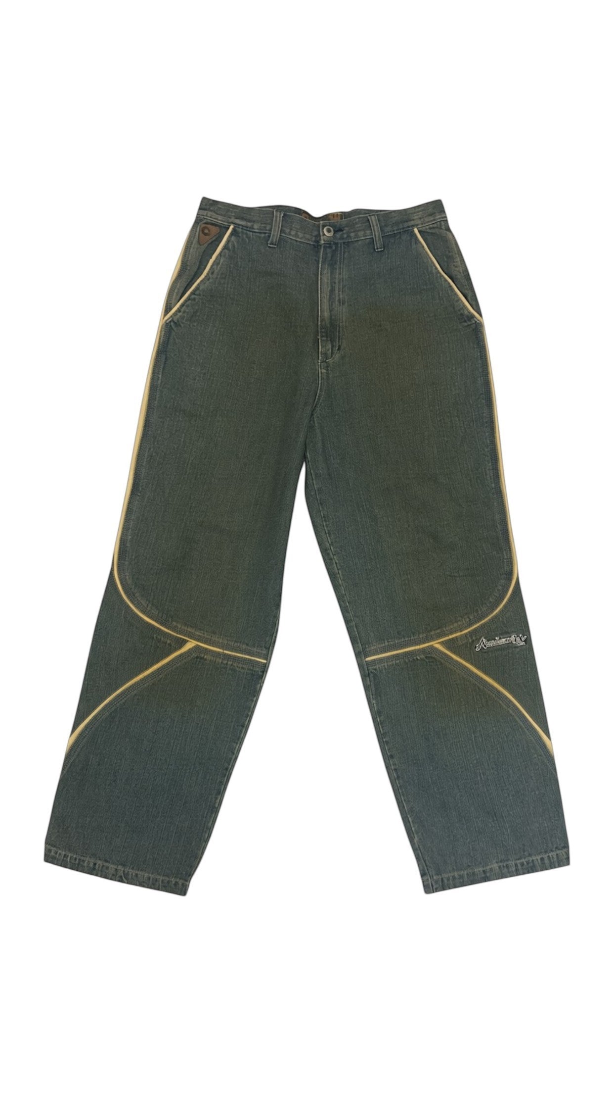 SohoStich Co. dark wash denim jeans with tan contrast stitching and vertical stripe detail.