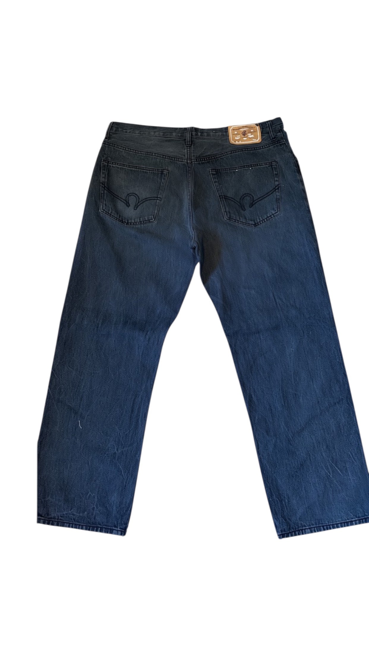 SohoStich Co. dark wash relaxed fit denim jeans for men with five-pocket design and branded leather patch.