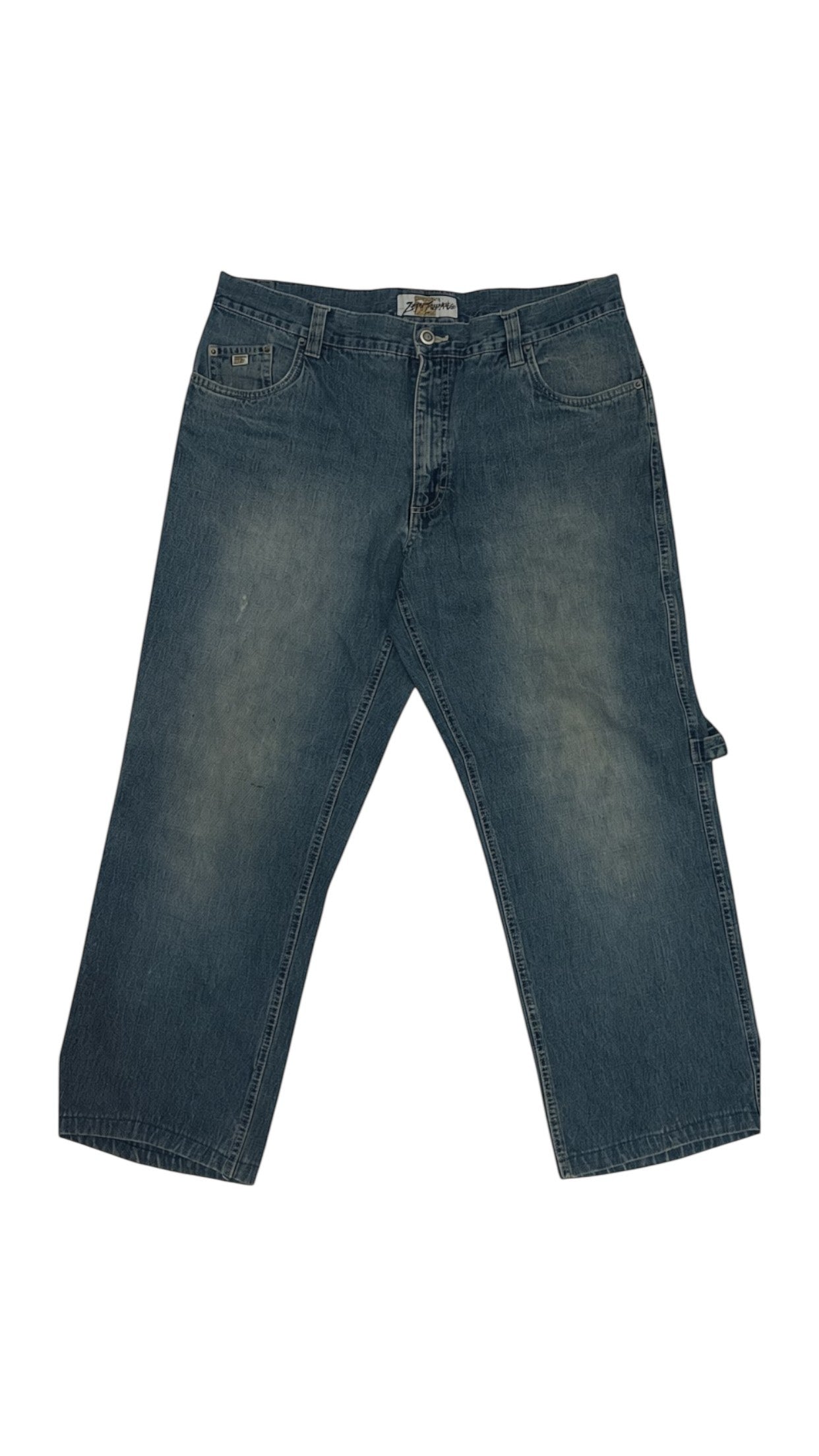 SohoStich Co. medium wash denim carpenter pants with utility pockets and a relaxed fit.