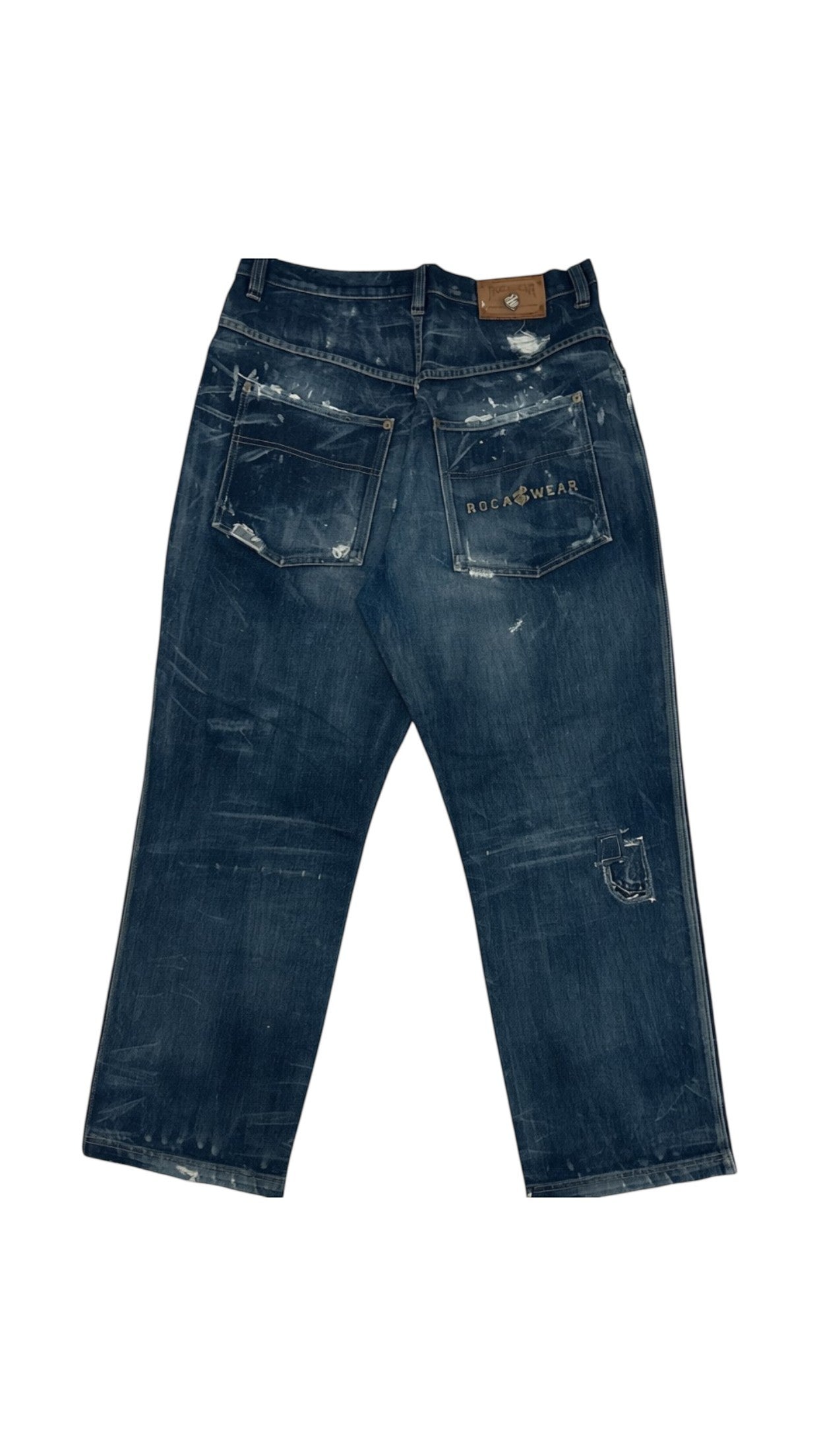 SohoStich Co. distressed dark wash relaxed fit denim jeans with paint splatters and rips.
