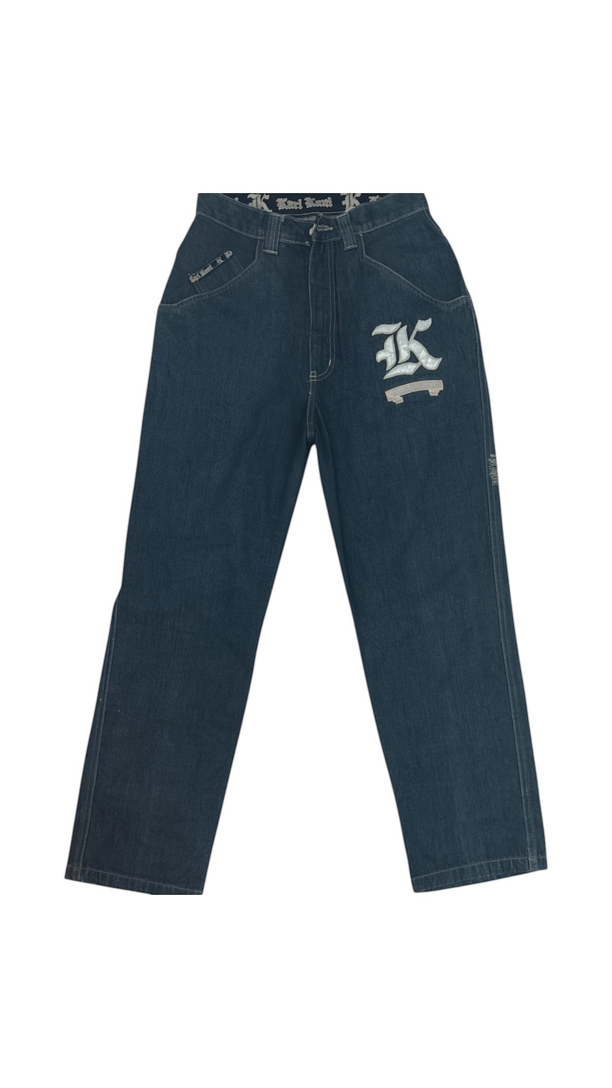 SohoStich Co. Karl Kani dark wash denim jeans with embroidered K logo on thigh and relaxed fit.