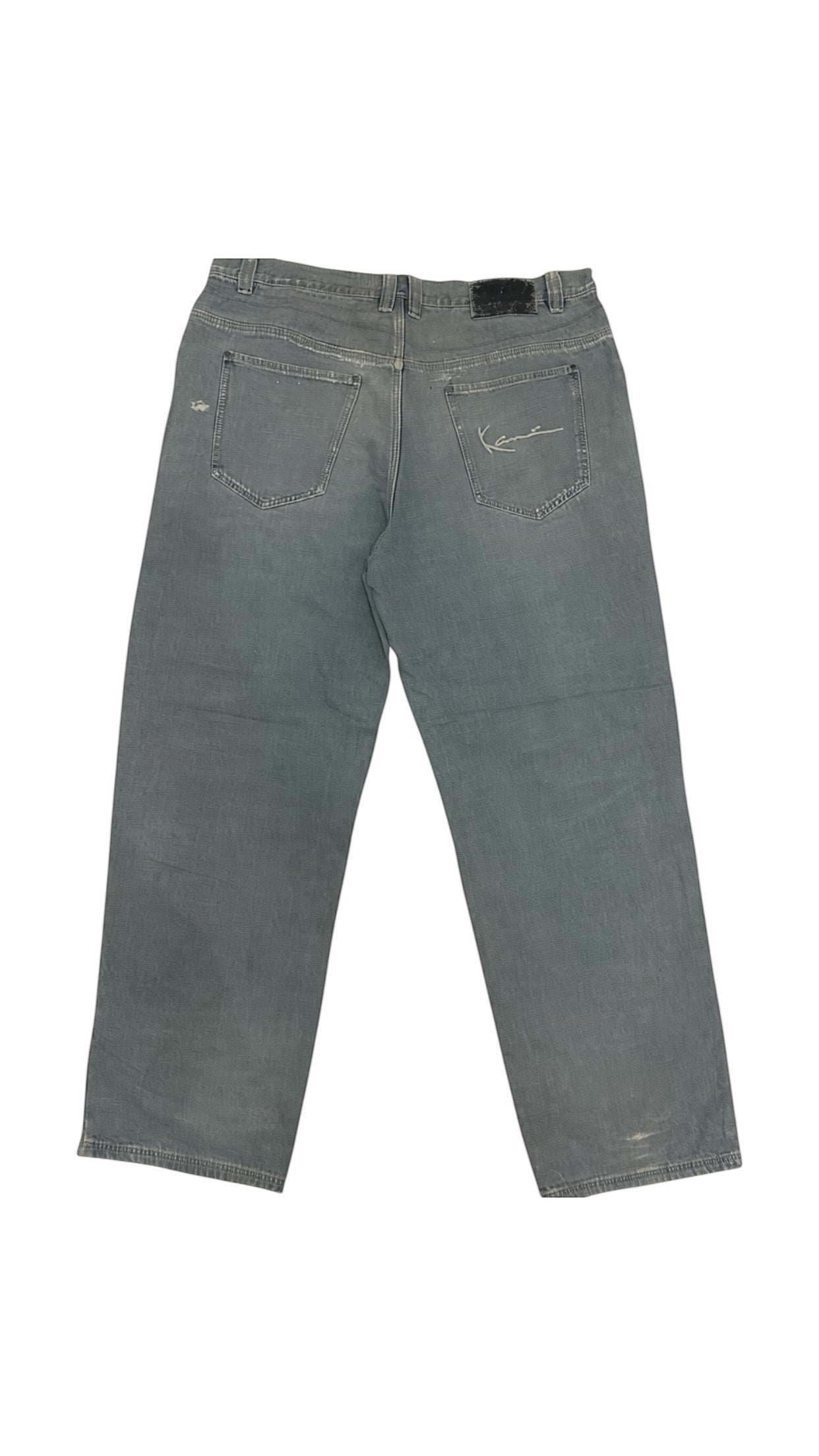 SohoStich Co. light blue distressed denim relaxed fit jeans with five-pocket style and signature embroidery.