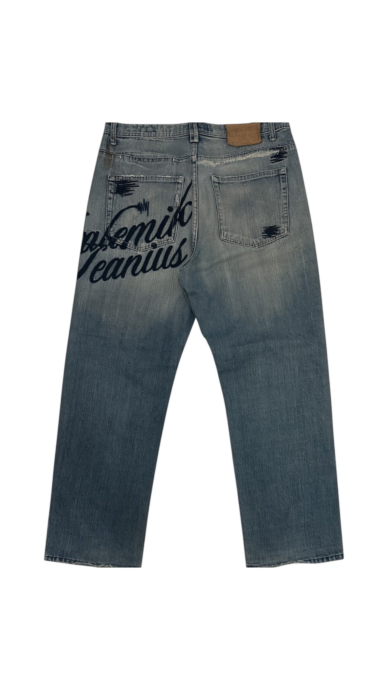 SohoStich Co. light-wash denim jeans with dark blue graphic print on back pockets and distressed details.
