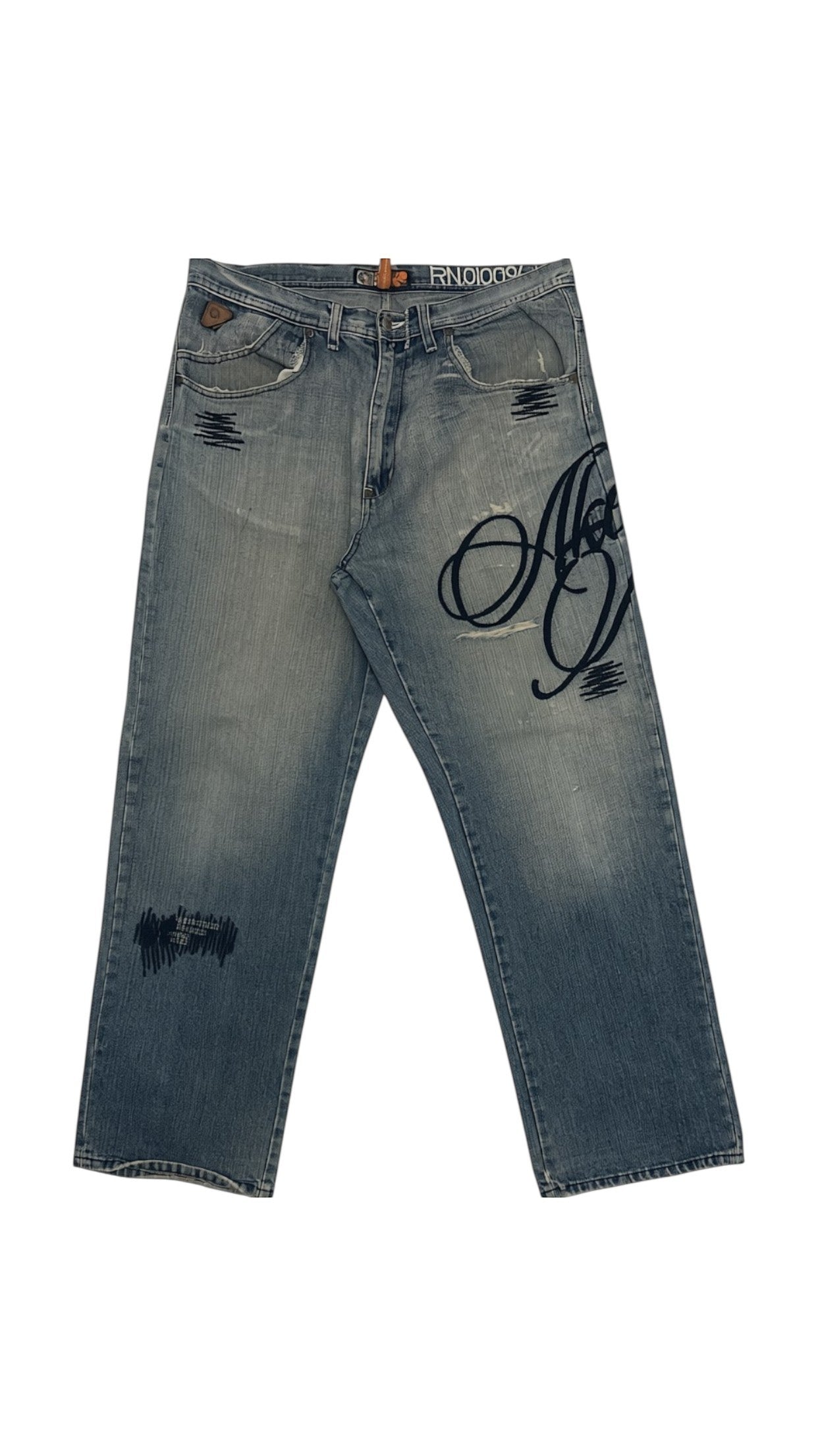 SohoStich Co. light wash denim jeans with dark blue graphic print and distressed details.