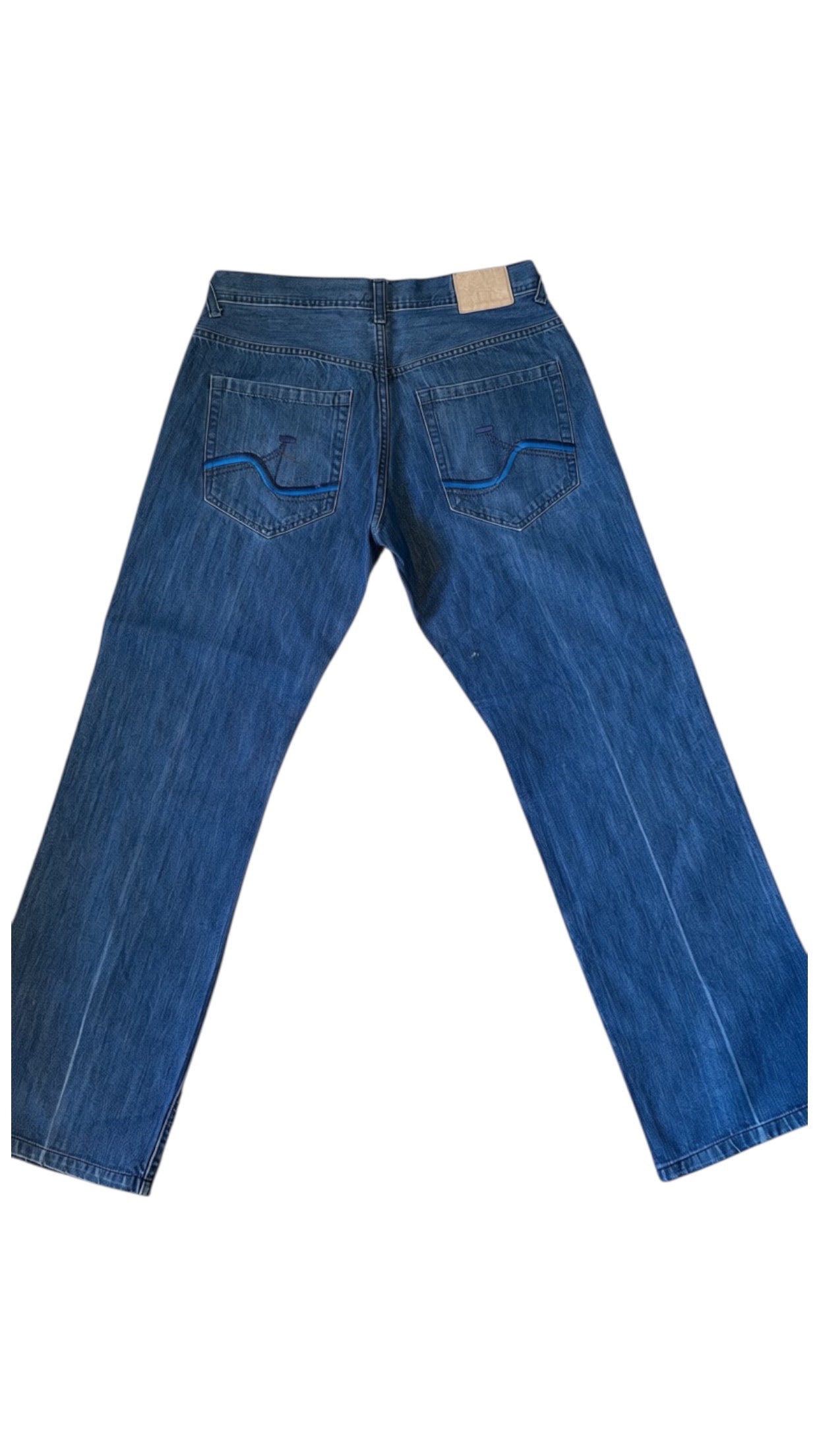 SohoStich Co. mid-wash denim jeans with relaxed fit, five-pocket design, and blue embroidered detail on back pockets.