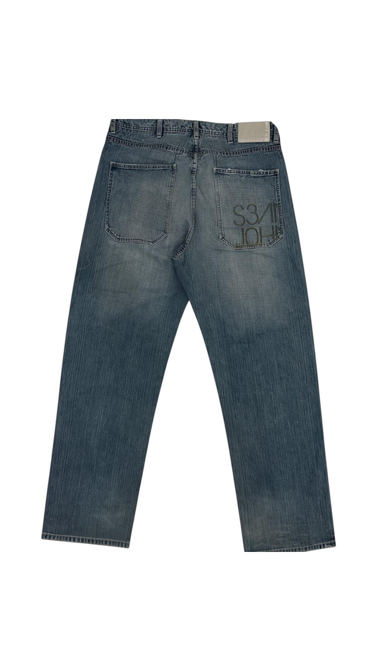 SohoStich Co. Saint John light wash blue denim jeans with graphic print on rear pocket. Relaxed fit, cotton denim.