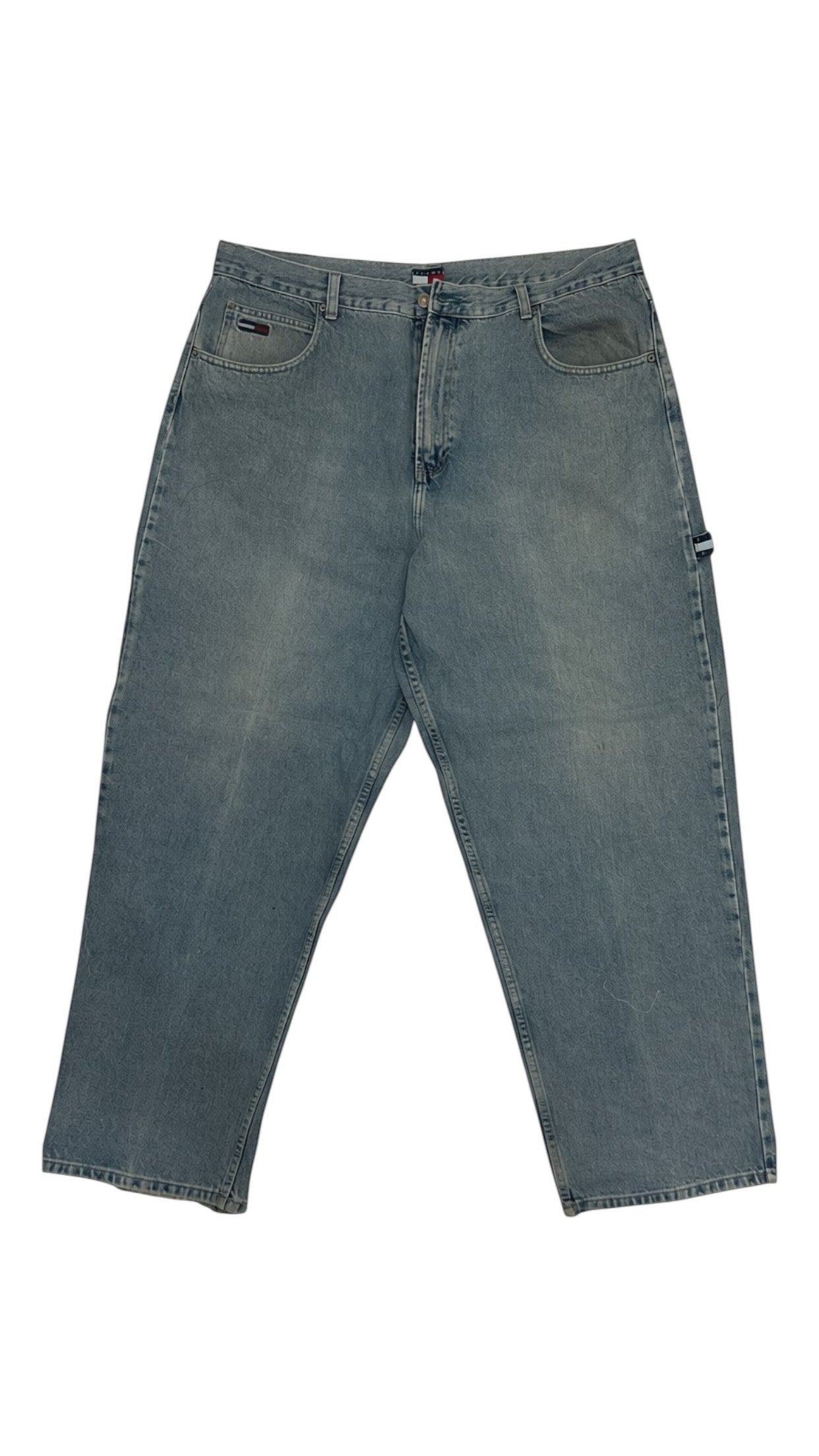 SohoStich Co. Tommy Hilfiger relaxed fit light wash denim jeans with five-pocket styling and flag logo detail.