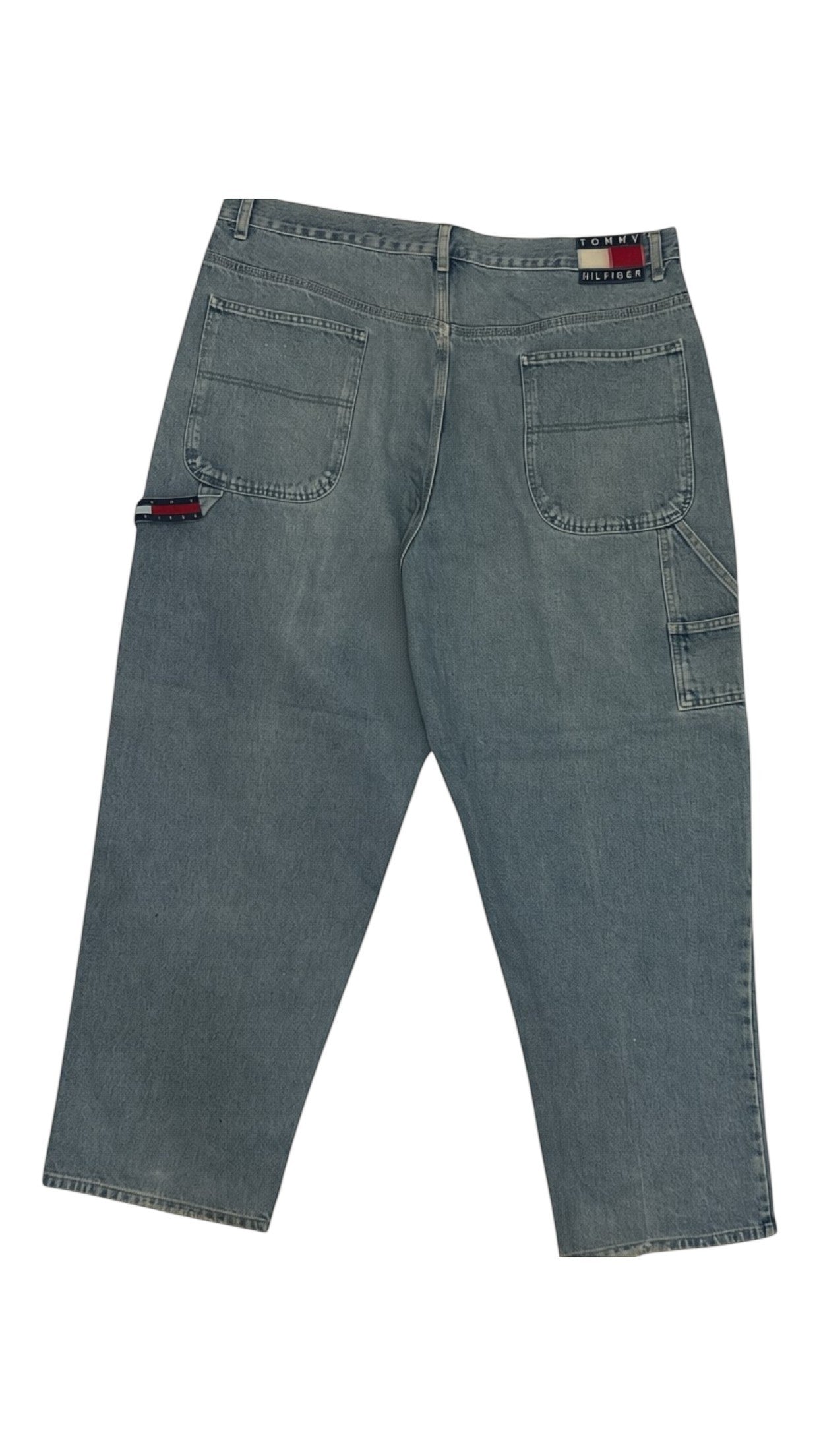 SohoStich Co. vintage light-wash denim jeans with relaxed fit and Tommy Hilfiger branding on coin pocket.